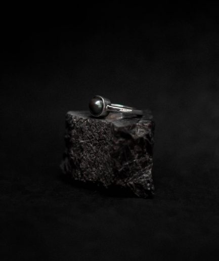 regal in its motif, also exudes a low key vibe ___ with a black pearl as the center stunner, this piece stands out as an thrilling ring.
