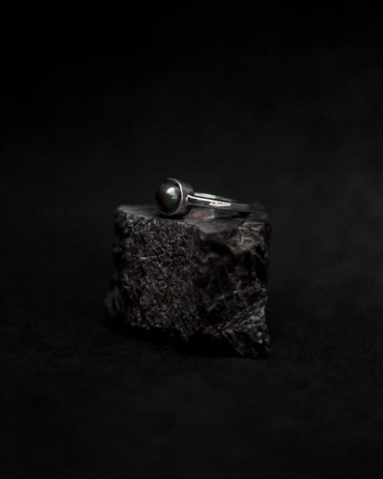 regal in its motif, also exudes a low key vibe ___ with a black pearl as the center stunner, this piece stands out as an thrilling ring.