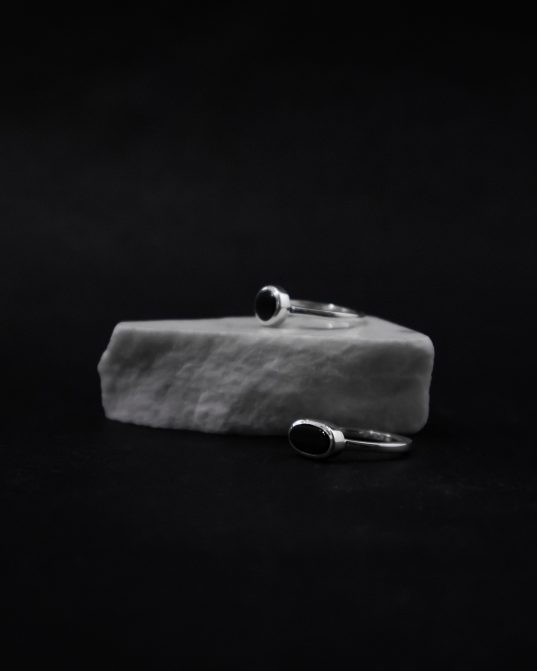 oval onyx & clean, sensual sterling silver lines ___self-sufficient as one, small enough to combine with other onyx rings.