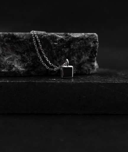 pendant with a 7mm square onyx stone set in the center of a sterling silver frame, this pendant will create a captivating and magnetic atmosphere around you at all times ___match with our 170321 ring. silver chains are not included and must be purchased separately.